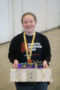 RWC student holding her robot